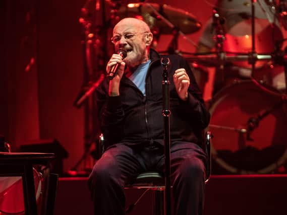 Genesis lead singer Phil Collins, who remained seated throughout the show due to his health issues, performs at First Direct Arena, Leeds.  (ANTHONY LONGSTAFF)