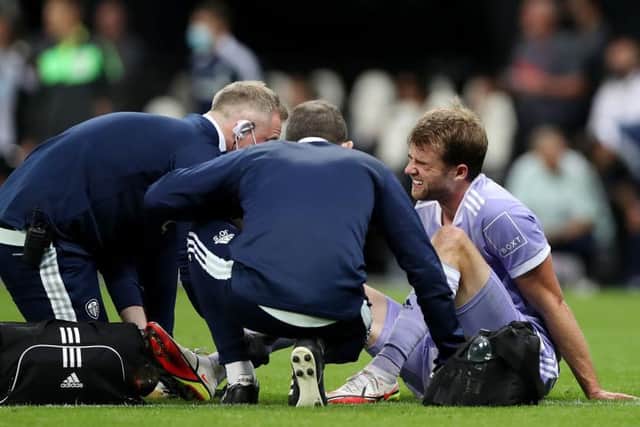 ANKLE PROBLEM: Patrick Bamford receives treatment at Newcastle United