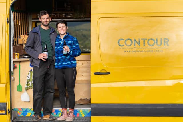 Tom and Caitlin with the DIY camper van conversion that led to their new business