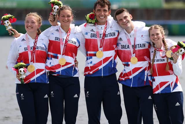 Ellen Buttrick, Giedre Rakauskaite, James Fox, Oliver Stanhope and Coxswain Erin Kennedy of Team Great Britain PR3 Mixed Coxed Four celebrates during the victory ceremony after winning the Gold medal on day 5 of the Tokyo 2020 Paralympic Games at Sea Forest Waterway. (Picture: Naomi Baker/Getty Images)