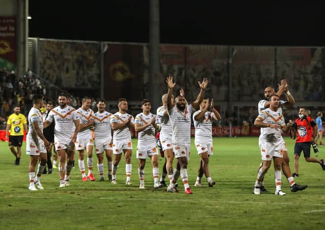 DESERVED: Players of Catalans Dragons' players celebrate victory over Hull KR on Thursday night. Picture by Manuel Blondeau/SWpix.com