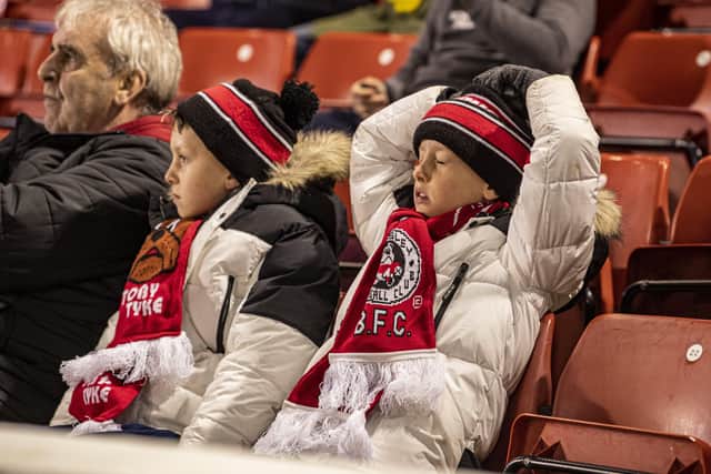 GRIM VIEWING: Young Barnsley
 fans show their despair at their team's second-half performance against Nottingham Forest on Wednesday. 
Picture: Tony Johnson