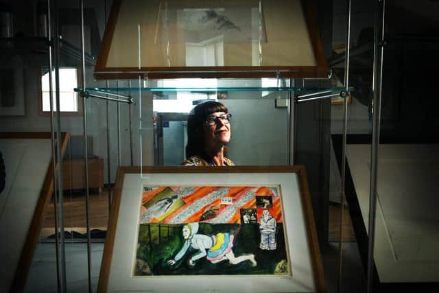 Pictured exhibitions officer for Barnsley Museums Alison Cooper with a Grayson Perry picture "reproduced by permission of the artist" 1st October2021. Picture : Jonathan Gawthorpe