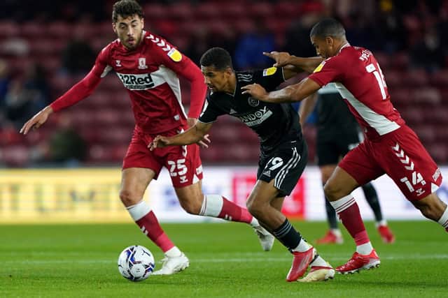 Sheffield United's Jack Robinson (centre) battles for the ball with Middlesbrough's Matt Crooks (left) and Lee Peltier during the Sky Bet Championship match at Riverside Stadium, Middlesbrough. (Picture: Owen Humphreys/PA Wire)