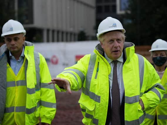 Prime Minister Boris Johnson and Health Secretary Sajid Javid (left), visit the construction site of the new children's hospital at Leeds General Infirmary in West Yorkshire.
