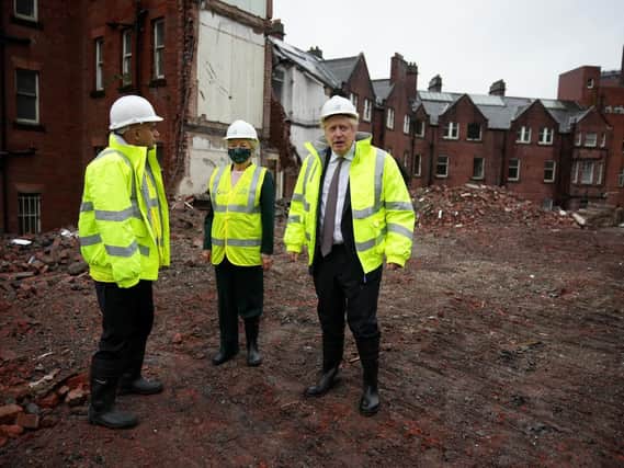 Prime Minister Boris Johnson (right) and Health Secretary Sajid Javid, visit the construction site of the new children's hospital at Leeds General Infirmary in West Yorkshire on Saturday. Picture: Christopher Furlong/PA