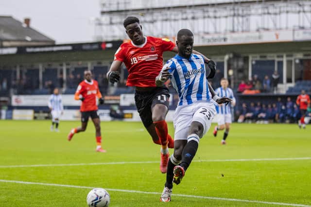 Luton Town's Elijah Adebayo (left) and Huddersfield Town's Mouhamadou-Naby Sarr battle for the ball (Picture: PA)