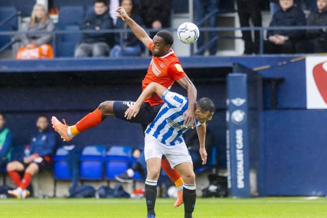 Luton Town's Kal Naismith (left) and Huddersfield Town's Matty Pearson battle for the ball during the Sky Bet Championship match at Kenilworth Road, Luton.(Picture: Leila Coker/PA Wire)