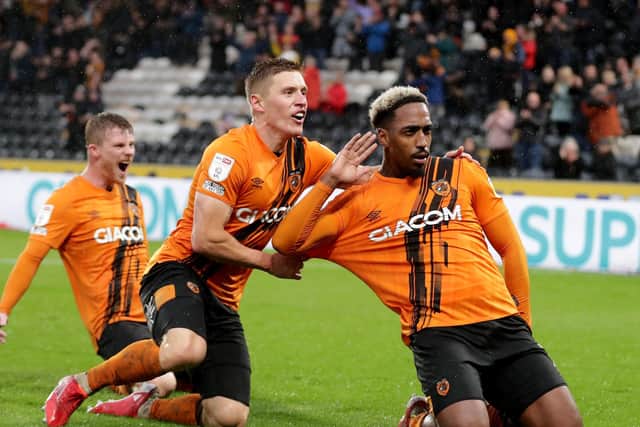 Hull City's Mallik Wilks (right) celebrates with teammate Greg Docherty (centre) (Picture: PA)