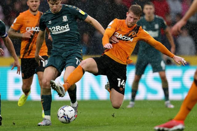 Middlesbrough's Paddy McNair tussles with Hull City rival Andy Cannon. Picture: PA.