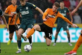 Middlesbrough's Paddy McNair tussles with Hull City rival Andy Cannon. Picture: PA.