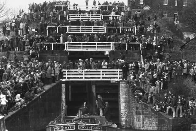 Thousands watch the barge, Wye, as she marks the 200th anniversary of the construction of the Five-Rise locks on the Leeds and Liverpool in 1974. (YPN).