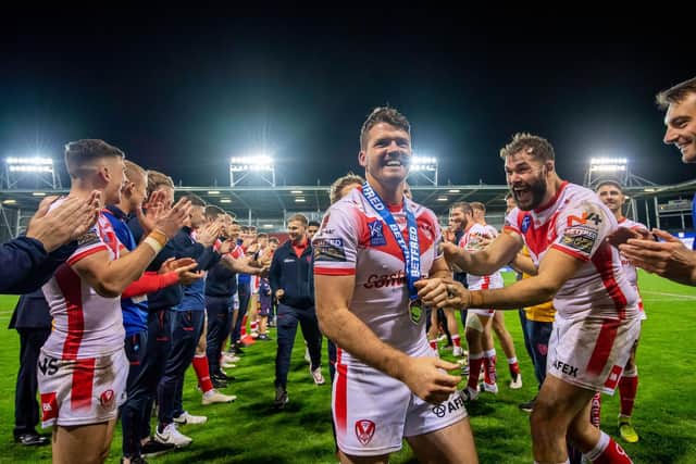 St Helens's Lachlan Coote has a guard of honour and congratulated by Alex Walmsley at the tunnel after his last home match for St Helens at the Totally Wicked Stadium.(Picture: SWPix.com)
