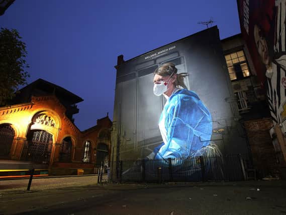 A mural depicting NHS nurse Melanie Senior, based on a photograph by Johannah Churchill, which The National Portrait Gallery commissioned artist Peter Barber to create in Manchester. Photo by Christopher Furlong/Getty Images.