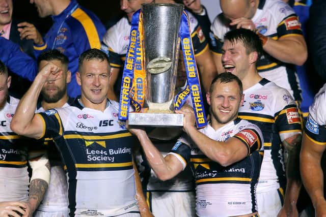 Leeds Rhinos players celebrate with the Super League Grand Final trophy after beating Castleford Tigers in 2017. Picture: Richard Sellers/PA