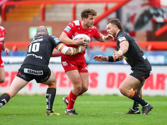 George Lawler is tackled by Grant Millington, left and Cheyse Blair during Hull KR's Challenge Cup loss to Tigers in April. Picture by Alex Whitehead/SWpix.com.