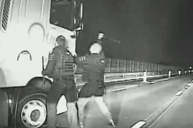 Watch the moment police bang on the HGV cab after the driver led them on a 20-mile chase