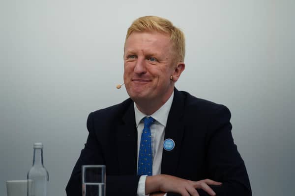 Conservative Party chairman Oliver Dowden wearing a Tory Scum badge during the Conservative Party Conference in Manchester (PA)