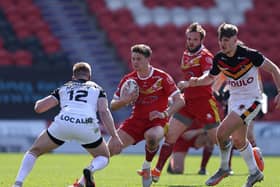Sheffield Eagles' Josh Guzdek takes on Bradford Bulls' Aaron Murphy in the opening game of the 2021 Betfred Championship season. Next year, matches will be shown live by Premier Sports. (John Clifton/SWpix.com)