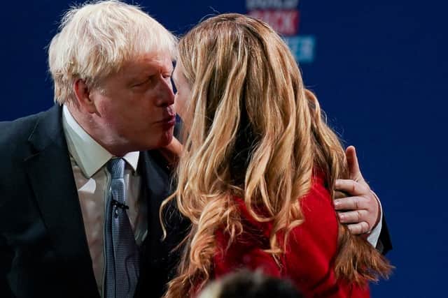 Boris Johnson embraces his wife Carrie after his Tory party conference speech.
