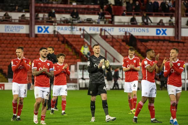 Barnsley's players applaud the fans with the West Stand behind them after the Championship play-off semi-final first leg game against Swansea City last season. Picture Bruce Rollinson