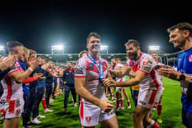 St Helens's Lachlan Coote has a guard of honour and congratulated by Alex Walmsley at the tunnel after his last home match at the Totally Wicked Stadium. Picture: Allan McKenzie/SWpix.com