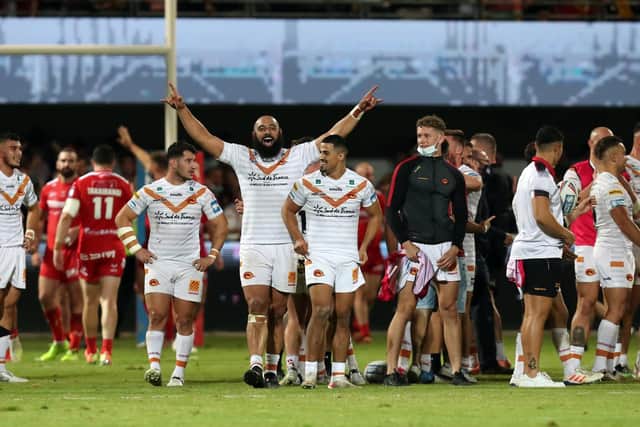 Catalans Dragons' players celebrate victory over Hull KR last Thursday. Picture by Manuel Blondeau/SWpix.com