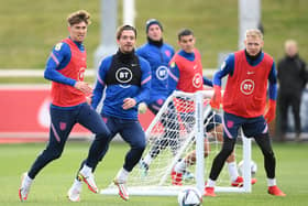 England trio John Stones, Jack Grealish and Aaron Ramsdale during a training session ahead of their World Cup qualifiers. (Photo by Michael Regan/Getty Images)