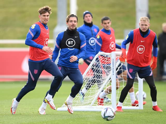 England trio John Stones, Jack Grealish and Aaron Ramsdale during a training session ahead of their World Cup qualifiers. (Photo by Michael Regan/Getty Images)