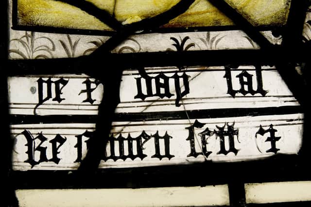 The Day 12 panel from the third window from All Saints Church North Street, York, showing some Old English text , when spoken is similar to Yorkshire dialect which translates to ' Dead men's bones shall set together and rise all at once' at Barley Studios near York Writer: Byline: Gary Longbottom