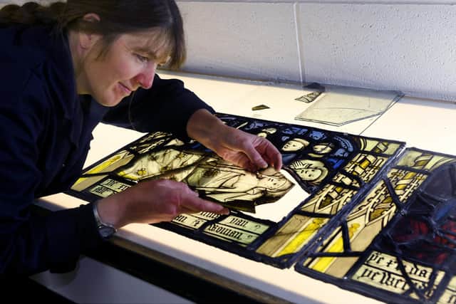 Alison Gilchrist a stained glass conservator at Barley Studio's near York working on a panel from the third window from All Saints Church North Street, York, . Writer: Byline: Gary Longbottom