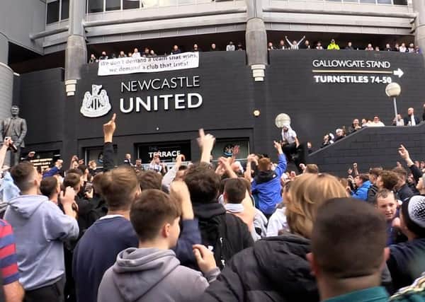 Jubilant Newcastle United fans celebrate the club's Saudi takeover outside the stadium. Picture: Tom Wilkinson/PA Wire