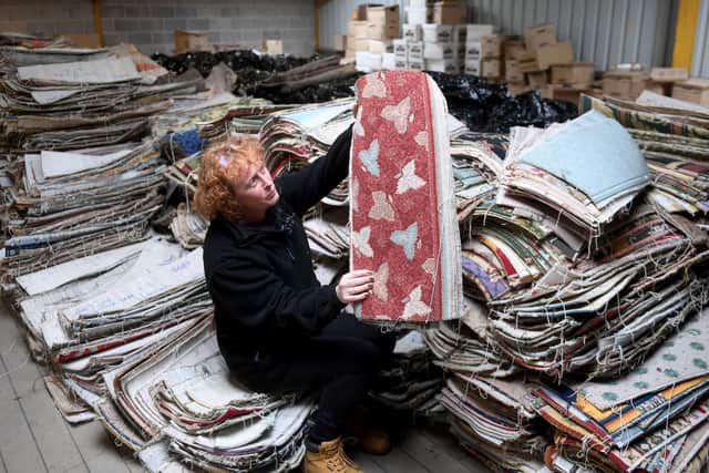 Rachel Tighe checks the Archive Slips at Avena Carpets. (Simon Hulme).
