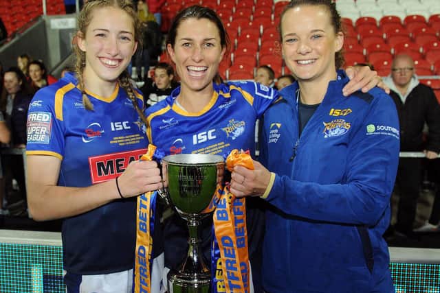 Caitlin Beevers, left, with captain Courtney Winfield-Hill and current coach Lois Forsell after Rhinos' 2019 Grand Final win. Picture by Steve Riding.
