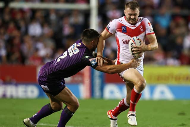NOT THIS TIME: Leeds Rhinos' Tom Briscoe tackles St Helens' Joe Batchelor evades a tackle from Luke Briscoe. Picture by Paul Currie/SWpix.com