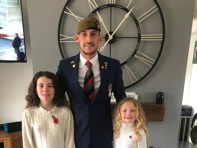 Veteran Ben Bainbridge, with daughters Ellie and Ariel.
