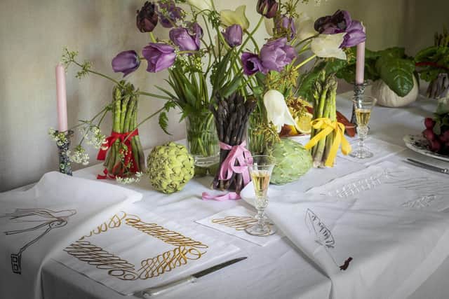 A table set for dinner with the Dinner at Wildfell Hall collection of linen placemats and napkins