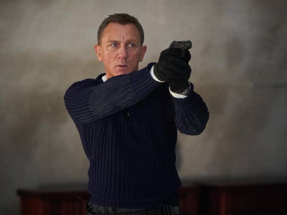 Daniel Craig playing James Bond for the final time in the new Bond film No Time To Die. (PA)