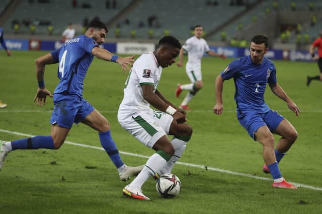 Republic of Ireland's Chiedozie Ogbene battles for the ball with Azerbaijan's Hojjat Haghverdi, left, and Gara Garayev at the Olympic stadium in Baku Picture: AP