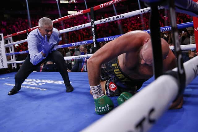 CLOSE CALL: Referee Russell Mora counts Tyson Fury after he was knocked down by Deontay Wilder in Las Vegas Picture: AP/Chase Stevens