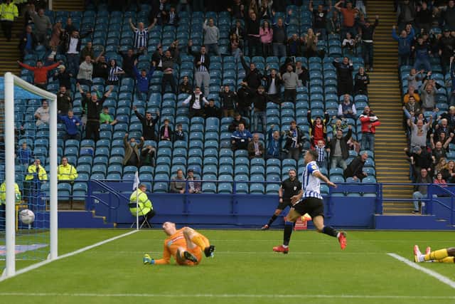 STRIKE ONE: Sheffield Wednesday's Lee Gregory wheels away to celebrate what proved to be the match-winning goal against Bolton Wanderers.   Picture: Steve Ellis