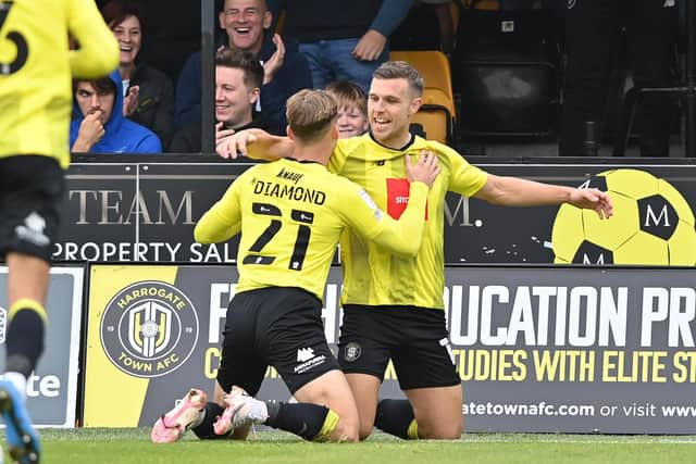 Harrogate Town's Jack Muldoon celebrates scoring his side's first goal Scunthorpe United on Saturday. Picture: Bruce Rollinson