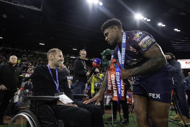 HERO WORSHIP: St Helens' Kevin Naiqama thanks Rob Burrow after receiving the Harry Sunderland trophy from Rob Burrow's daughter Maya after victory over Catalans Dragons Picture by Allan McKenzie/SWpix.com
