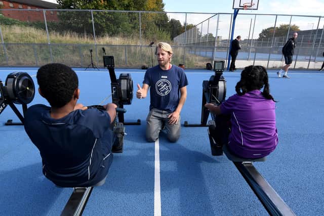 Three-times Olympic rowing gold medallist Andy Triggs Hodge teaches pupils how to row on rowing machines at Dixons Trinity Chapeltown School in Leeds. Picture: Simon Hulme