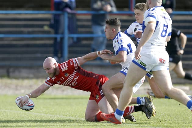 Opener: Doncaster's Liam Johnson scores his side's first try in the defeat by Workington. Picture by Ed Sykes/SWpix.com