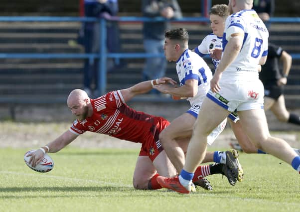 Opener: Doncaster's Liam Johnson scores his side's first try in the defeat by Workington. Picture by Ed Sykes/SWpix.com