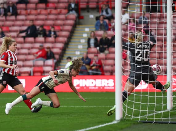 HEADING HOME: Leanne Kiernan of Liverpool scores their team's second goal past Fran Kitching of Sheffield United. Picture: Getty Images.