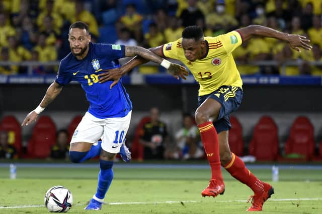 Burnout? Neymar Jr. of Brazil fights for the ball with Yerry Mina of Colombia during a match between Colombia and Brazil as part of South American Qualifiers for Qatar 2022 at Estadio Metropolitano on October 10, 2021 in Barranquilla, Colombia. (Picture: Guillermo Legaria/Getty Images)