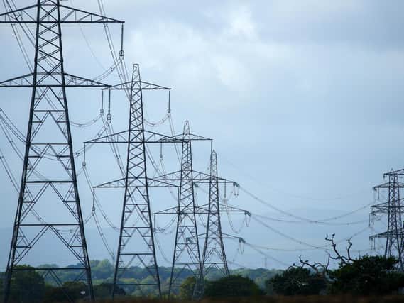 A view of electricity pylons in Cheshire (PA)