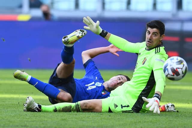 TURIN, ITALY - OCTOBER 10:  Federico Chiesa of Italy competes for the ball with Thibaut Courtois of Belgium during the UEFA Nations League 2021 Third Place Match on Sunday, a game that Courtois believes was unnecessary. (Picture: Claudio Villa/Getty Images)